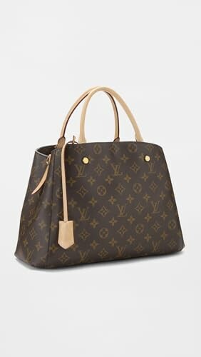Louis Vuitton monogram handbag with tan handles.