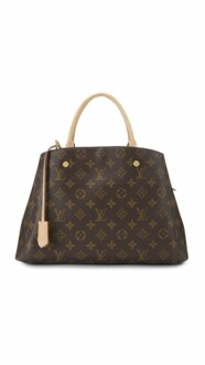 Luxury handbag with monogram pattern and leather handles