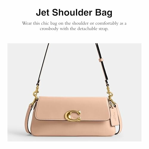 Pink shoulder bag with gold accents and detachable strap.